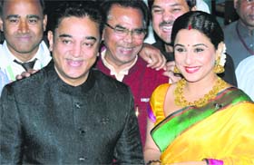 Actors Kamal Haasan and Vidya Balan and renowned poet Ashok Chakradhar (centre) during Padma Awards 2014 at Rashtrapati Bhawan in New Delhi on Monday.