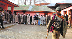   A CRPF jawan stands guard during the 2012 panchayat polls in Srinagar.