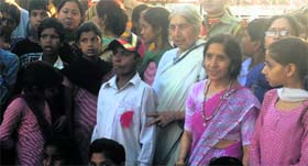 BJP leader Laxmi Kanta Chawla with poor children at the Attari-Wagah joint check-post in Amritsar on Tuesday.