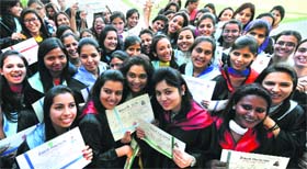 Students in a jubilant mood after receiving their degrees during the annual convocation of the Post-Graduate Government College for Girls on Tuesday.