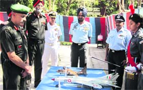 Lt Gen Aniruddha Chakravarty (extreme left), Director General, National Cadet Corps, inspects an aero model in Chandigarh on Tuesday.