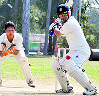 A batsman plays a shot in a match in the District Cricket League at the OFD ground in Dehradun on Tuesday