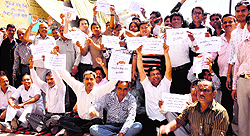 Lawyers, typists and local people hold a protest at the tehsil office in Haridwar on Tuesday against the logging of a 300-year-old peepal tree
