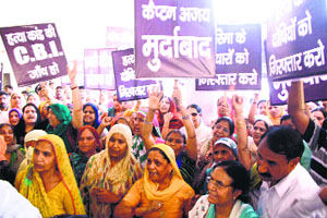 Residents of Chakrapur village take out a protest march in Rewari on Tuesday.