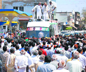 Chief Minister Bhupinder Singh Hooda during a roadshow in Rewari on Tuesday.