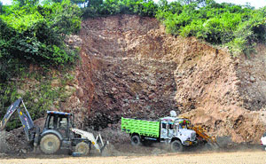 JCB machines being used to flatten a hillock along the Kangra-Una road.