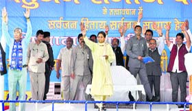 BSP chief Mayawati waves to her supporters during an election rally in Jammu on Tuesday.
