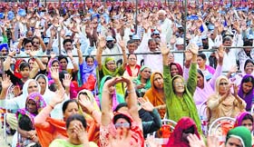 BSP supporters wave to party chief Mayawati during an election rally in Jammu on Tuesday.