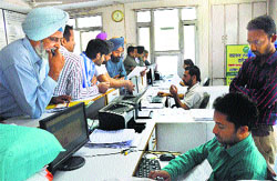 Residents at the MC office in Ludhiana. Photo: Inderjeet Verma
