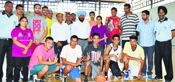 Winners of the 65th Punjab State Basketball Championship are all smiles. Photo: Inderjeet Verma