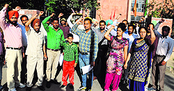 Unpaid teachers protest outside the Treasury office in Bathinda on Tuesday