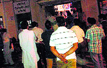 Government school teachers outside the district treasury office in Faridkot on Monday night