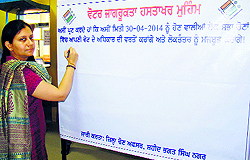 Deputy Commissioner Anindita Mitra launches a signature campaign for voters awareness at Suvidha Centre in Nawanshahr on Monday
