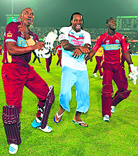 Darren Bravo, Chris Gayle and Darren Sammy celebrate their win against Australia, the talking point of this World T20