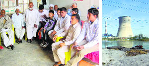 Villagers discuss problems arising due to pollution from the Panipat Thermal Power Station (right). 