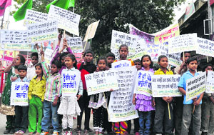 Students of Appu Society School take out a rally asking questions from politicians in Bathinda on Wednesday.