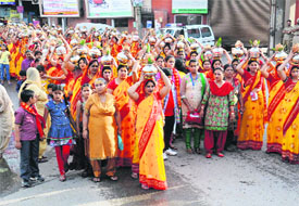 Devotees take part in a Kalash Yatra in Bathinda on Wednesday.