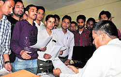 Student leaders submit a complaint against opening of liquor shops at Sahstradhara to District Excise officer SK Kamboj in Dehradun on Wednesday