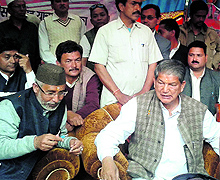 Chief Minister Harish Rawat with Congress MP from Almora Pradeep Tamta at an election meeting at Madkot in Pithoragarh district on Wednesday
