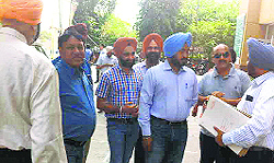 Contractors and officials at the MCs Zone D office in Ludhiana on Wednesday