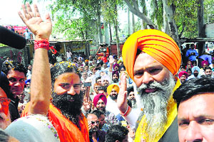 Baba Ramdev campaigns for SAD candidate Prem Singh Chandumajra in Kharar on Wednesday.
