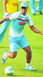Captain Darren Sammy plays football during a training session in Dhaka on Wednesday. West Indies play Sri Lanka in the first semifinal today.