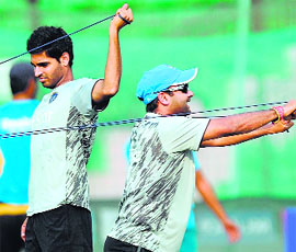 Indian bowlers Bhuvneshwar Kumar and Amit Mishra take part in a training session in Dhaka on Wednesday.