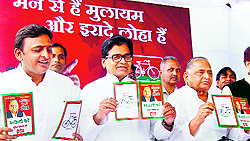 UP Chief Minister Akhilesh Yadav, Samajwadi Party leader Ram Gopal Yadav and party chief Mulayam Singh Yadav release their party manifesto in Lucknow on Wednesday