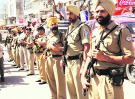 The paramilitary force and the city police conduct a flag march at Lawerence Road in view of the coming Lok Sabha elections in Amritsar on Thursday.