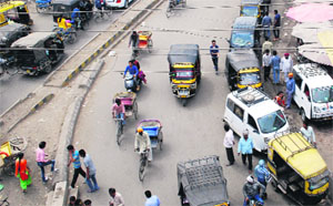 Awaiting passengers, auto-rickshaws are seen parked outside the bus stand in Amritsar.