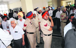 Police personnel outside the Bar Room to prevent any untoward incident; and (below) an advocate shows a broken lock at the District Courts Complex in Bathinda on Thursday. Tribune photo: Pawan Sharma