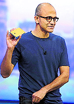 Microsoft CEO Satya Nadella holds up the Nokia Lumia 930 phone that uses Windows 8.1 during the Build Conference in San Francisco on Wednesday. Microsoft kicked off its annual conference for software developers, with new updates to the Windows 8 operating system and upcoming features for Windows Phone and Xbox
