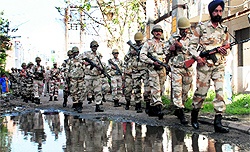 Ahead of the Lok Sabha elections, ITBP jawans hold a flag march in Sector 20, Panchkula, on Thursday