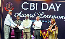 Senior public prosecutor Pawan Kumar Dogra receives the Directors Commendation Certificate during an award ceremony at the CBI Headquarters in New Delhi