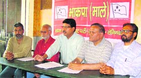 CPI (ML) state Secretary Rajiv Partholi (centre) addresses a press conference in Dehradun on Thursday.