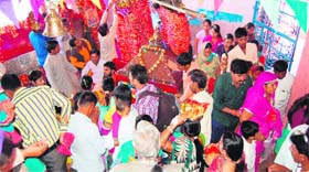 Devotees perform rituals at Mata Chamunda Devi temple on the fourth day of the Navratra festival in Haridwar on Thursday.