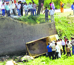 The canter that fell into a drain, injuring two persons, on the Kaithal-Jind road on Thursday. 