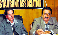 Kashmir Hotels and Restaurant Association (KHARA) president Showkat Chowdhary addresses a press conference in Srinagar on Thursday