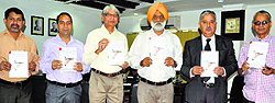 Prof Mohan Pal Singh Isher, Vice Chancellor, University of Jammu, releases book Contemporary trends in tourism and hospitality management on Thursday