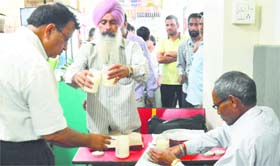Officials of the health department collect food samples at the bus stand in Ludhiana on Thursday.
