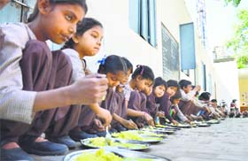 Students take their mid-day meal at a government school in Ludhiana.