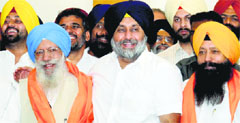 SAD chief Sukhbir Badal welcomes Sukhdev Singh Libra into the party in Chandigarh on Thursday. Tribune photo