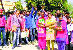 Students of MR Government College protest outside the institute in Fazilka on Thursday. Tribune photo
