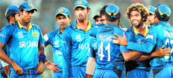 Lasith Malinga celebrates with teammates after taking the wicket of Dwayne Smith at the Sher-e-Bangla National Cricket Stadium in Dhaka on Thursday. AFP 