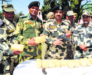 M F Farooqui, DIG, BSF, and other officers show contraband and arms in Amritsar.