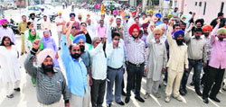 Staff of the Civil Hospital OPD protest against the Punjab government demanding release of their salaries in Bathinda on Friday. Tribune photo
