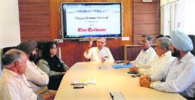 Congress candidate for the Chandigarh Lok Sabha seat Pawan Kumar Bansal (centre) at an interactive session Chandigarh Votes 2014 at The Tribune office in Chandigarh on Friday. Prominent residents (from left) Nirmal Dutt, Charanjiv Singh, Ronki Ram, PC Sanghi, Neeraj Nagpal and Col Gursewak Singh also took part in the session.