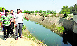 Villagers point out at the Hansi-Butana canal on State Highway 65 near Pehowa town