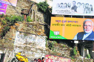 Election hoardings of different political parties at the old bus stand in Shimla.