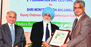 Planning Commission Deputy Chairman Montek Singh Ahluwalia with Central University of Himachal Pradesh Vice-Chancellor Furqan Kamar (right) on the university campus in Shahpur on Friday.